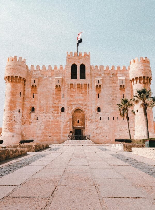 Majestic view of the medieval Citadel of Qaitbay in Alexandria, Egypt, under a clear sky.