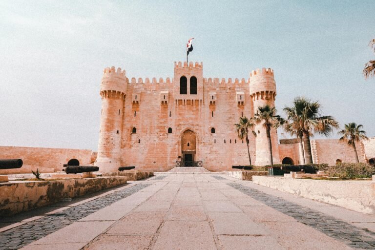Majestic view of the medieval Citadel of Qaitbay in Alexandria, Egypt, under a clear sky.
